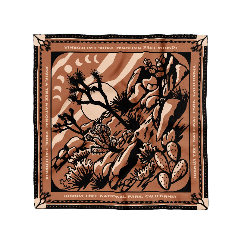 Soft brown and black scarf featuring a desert scene inspired by Joshua Tree, made from 100% organic cotton.