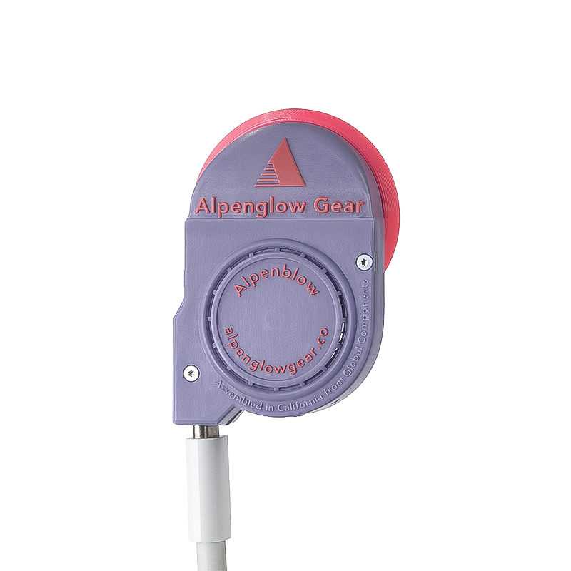 Purple and pink Alpenblow Micro Inflator labeled "alpflow" for quick sleeping pad inflation.