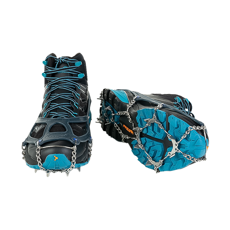 Black and blue running shoe featuring chains underneath, ideal for trail running on icy or compacted snow surfaces.