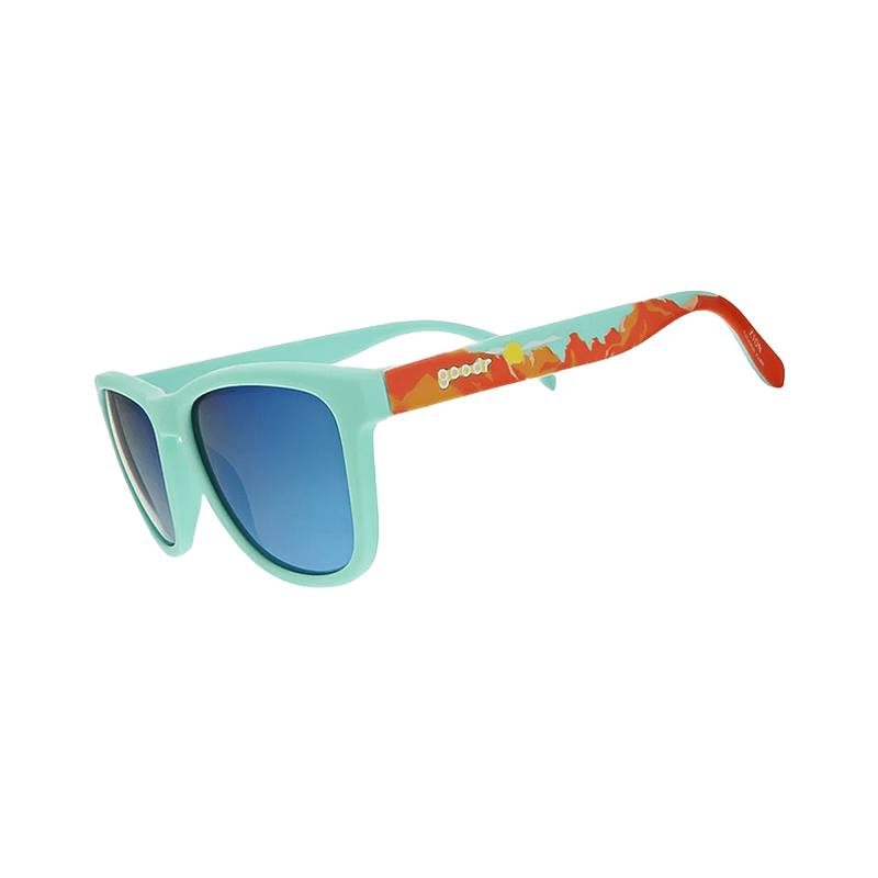 Mint Green-framed Goodr OG sunglasses with orange mountains, designed for outdoor comfort and durability.