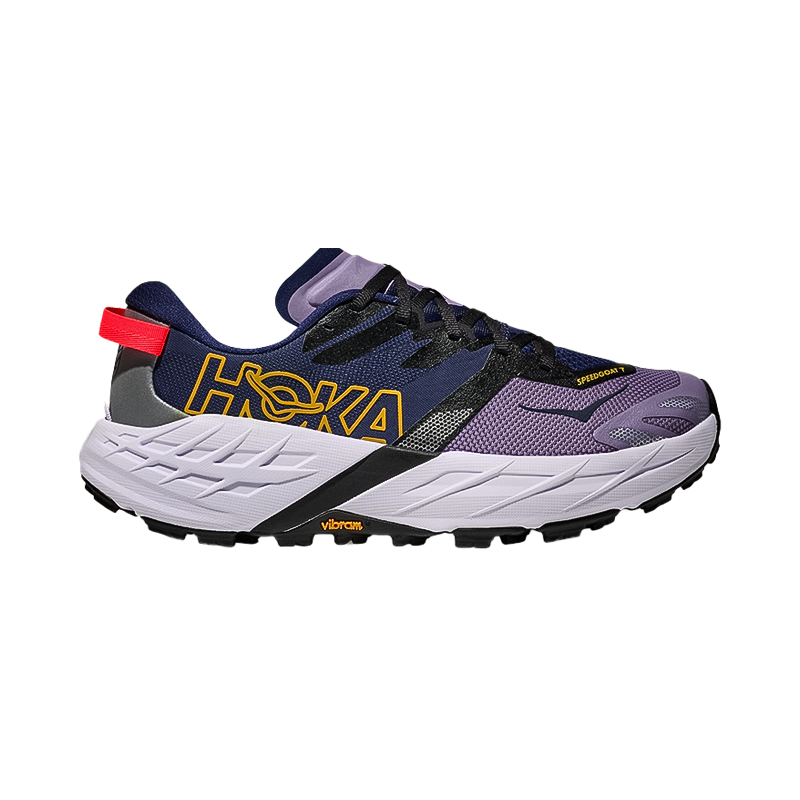 Purple, black, and yellow Hoka Speedgoat 7 shoes for woman, featuring max cushioning and aggressive traction for trail running.