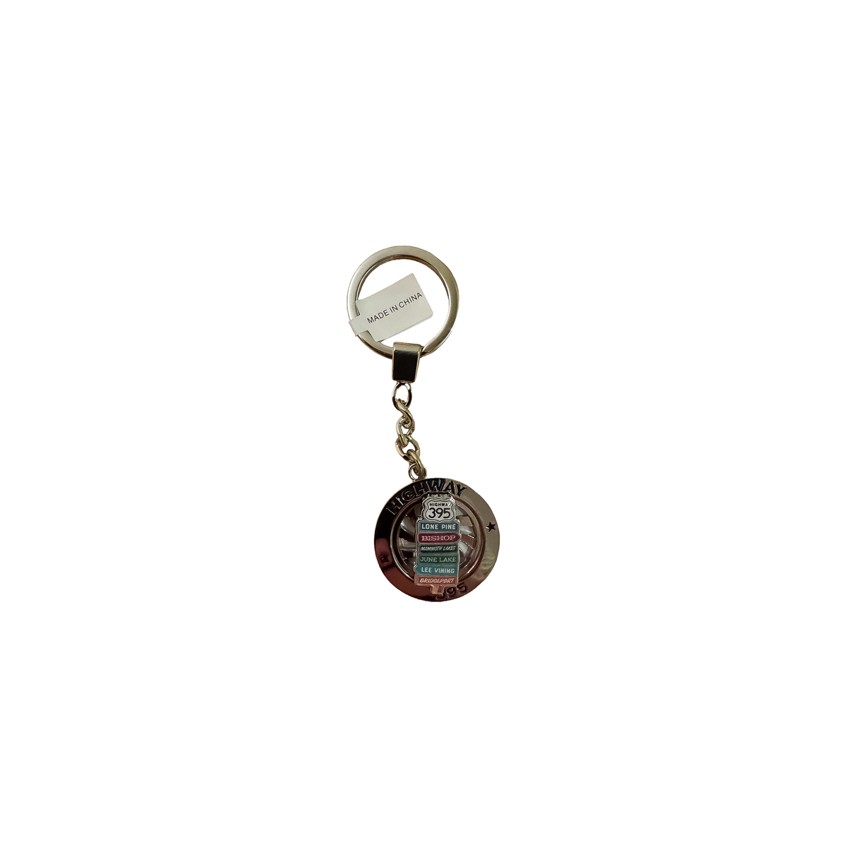 A detailed keychain featuring a small metal keyring, showcasing charm designs inspired by the Eastern Sierra region.