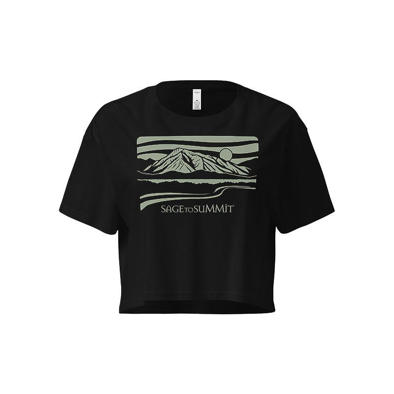 Black crop top featuring "the mountains" text, perfect for casual wear and outdoor adventures.