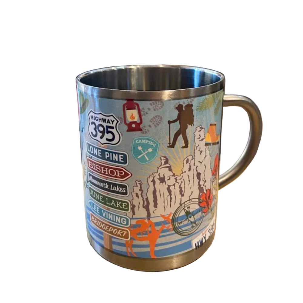 A stainless steel mug with colorful printed designs including text and images related to Highway 395 and camping.
