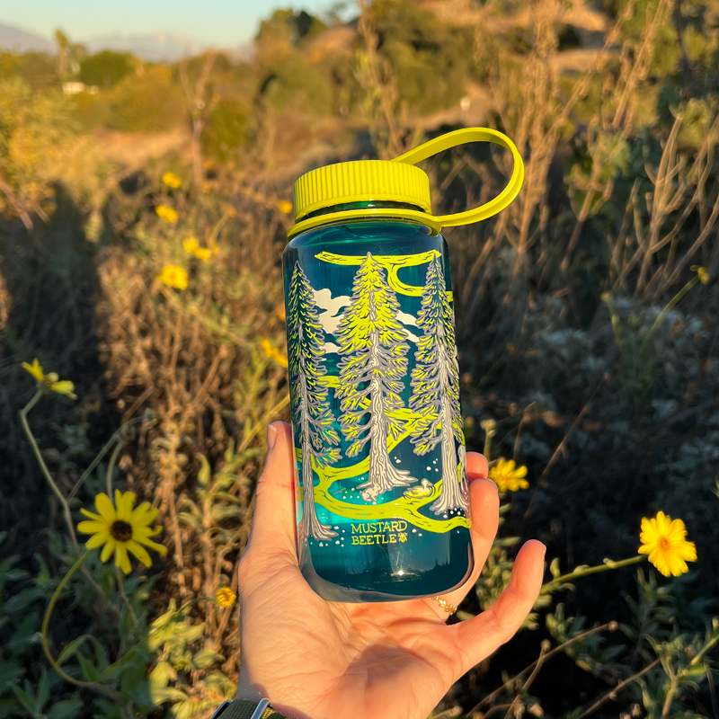 Eco-friendly blue water bottle featuring the Redwoods design, ideal for personalized hydration.