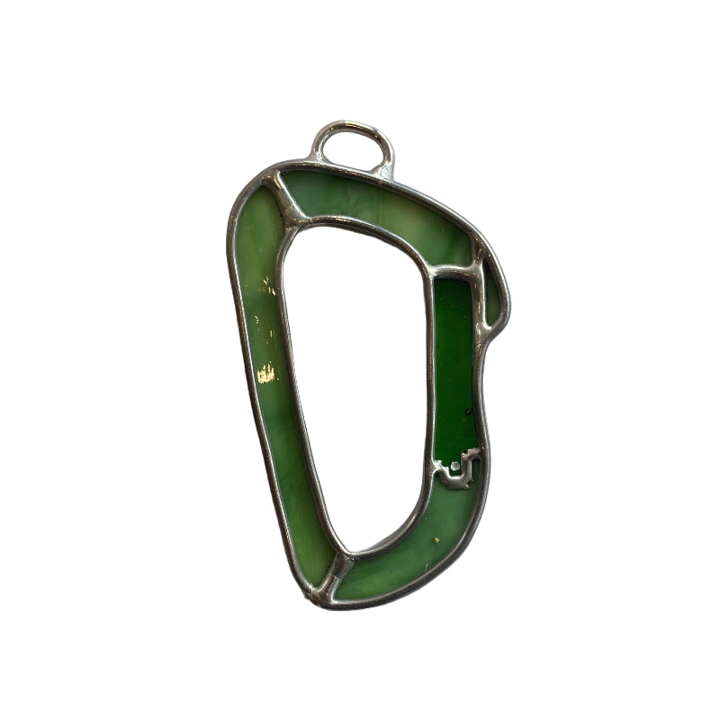 Green and silver carabiner on a white sheet of paper