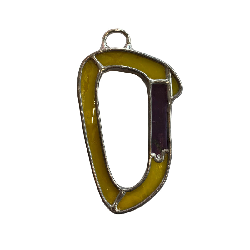 Yellow carabiner on a white paper background