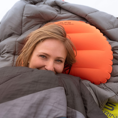 ALPS Mountaineering Versa Pillow in color orange.