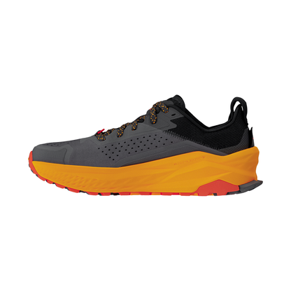 Altra Olympus 6 trail running shoes in black and orange, featuring a breathable upper and Vibram outsole for traction.