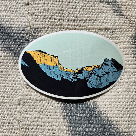 A colorful mountain scene sticker, designed for adventure lovers, made from weather-resistant vinyl for lasting use.