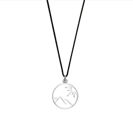 Black lightweight nylon necklace with a sterling silver openwork mountain and tree pendant, ideal for everyday wear.