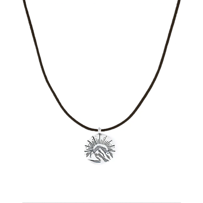 A lightweight sun and mountain charm necklace, ideal for everyday and water-friendly wear.