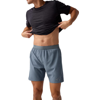 Gray lightweight Brooks Men's 7" 2-in-1 running shorts with sweat-wicking liner for comfort.