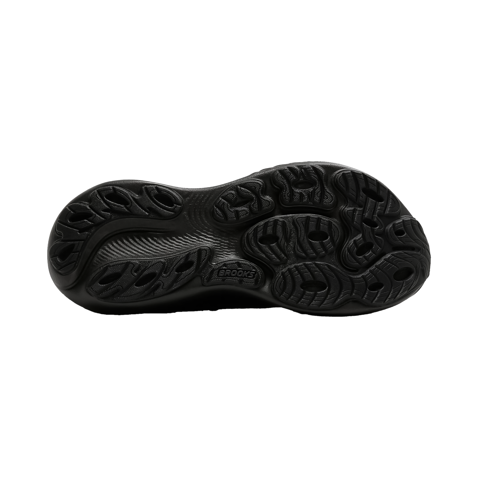 Close-up of a black shoe sole on a white background, highlighting its tread pattern and cushioning technology.