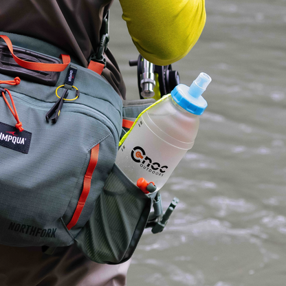 A pack that holds a water bottle featuring the CNOC BiteValve, designed for easy, spill-free drinking on the go.