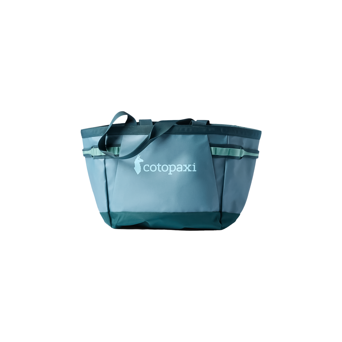 Blue green tote bag with "cotopaxi" text, ideal for transporting gear, made from water-resistant, recycled fabrics.