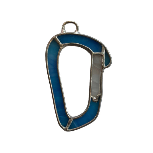 Blue and silver metal clip on a white sheet of paper