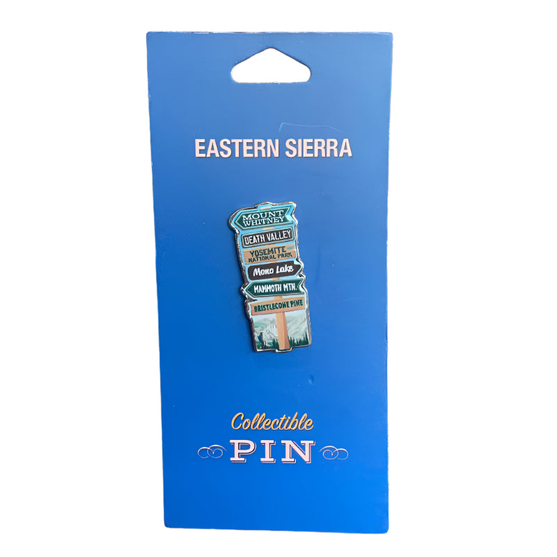 a collectible pin featuring towns in the eastern sierra 