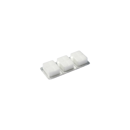 Three solid fuel tablets arranged in a white square on a white surface, designed for ultralight backpacking stoves.