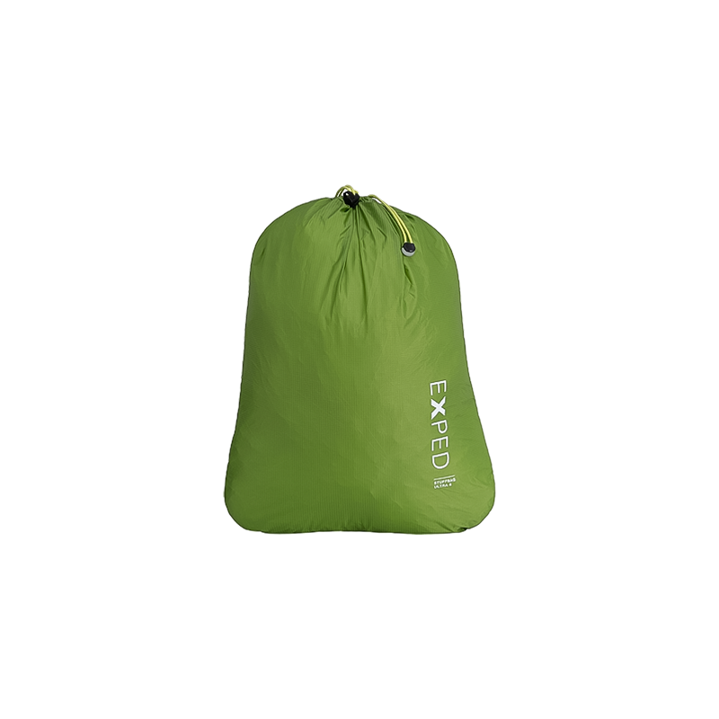 Green Exped Stuffbag Ultra with a drawcord closure, lightweight and waterproof, ideal for organizing camping gear and clothing.