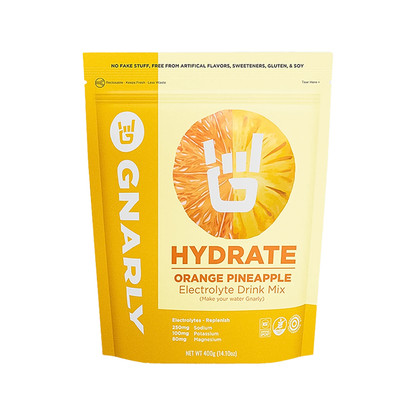 Hydrate orange pineapple and coconut mix, a low-sugar electrolyte powder for athletes, promoting hydration and energy.