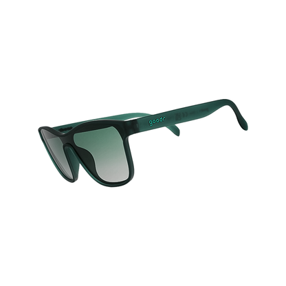 Stylish green-lensed sunglasses on a white background, designed for outdoor activities.