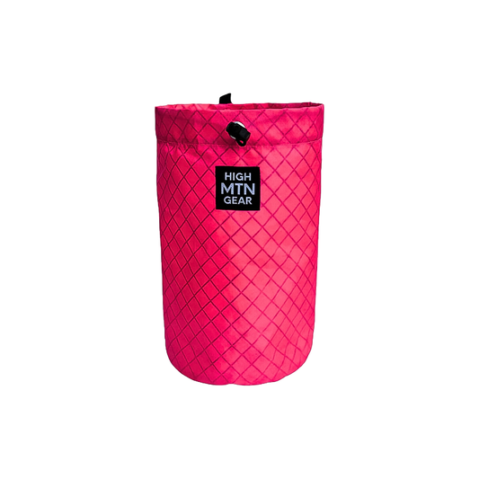 Neon pink rope bag to carry ropes for climbing.