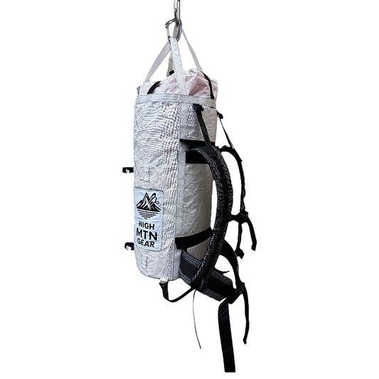 Lightweight High Mountain Gear Wallpinist 45L Haul Bag with a white attachment, designed for extreme climbing.