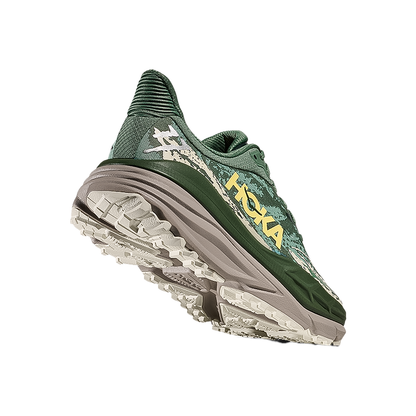 Green Hoka One One men's Stinson 7, built for durability and traction in all-terrain running.