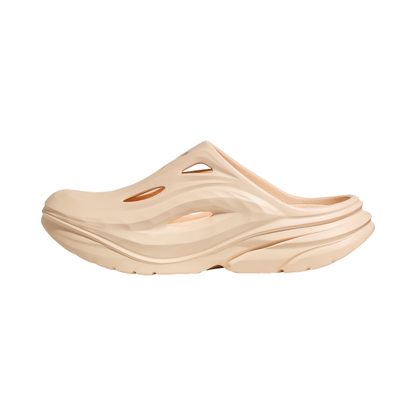 Beige slip-on slippers designed for comfort and support during post-run recovery and casual wear.