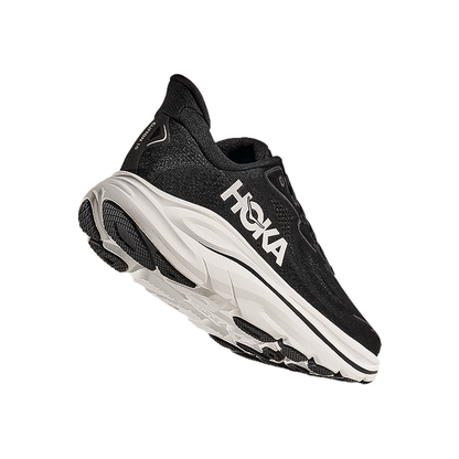 Sole of a black and white Hoka Clifton 10 women's shoes, offering plush cushioning and stability for running and walking activities.