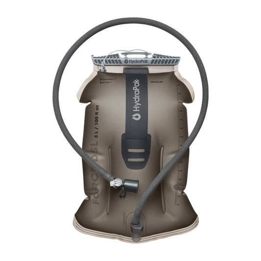 Large dark gray hydration reservoir with a hose, designed for outdoor use, showcasing rugged construction and compact shape.
