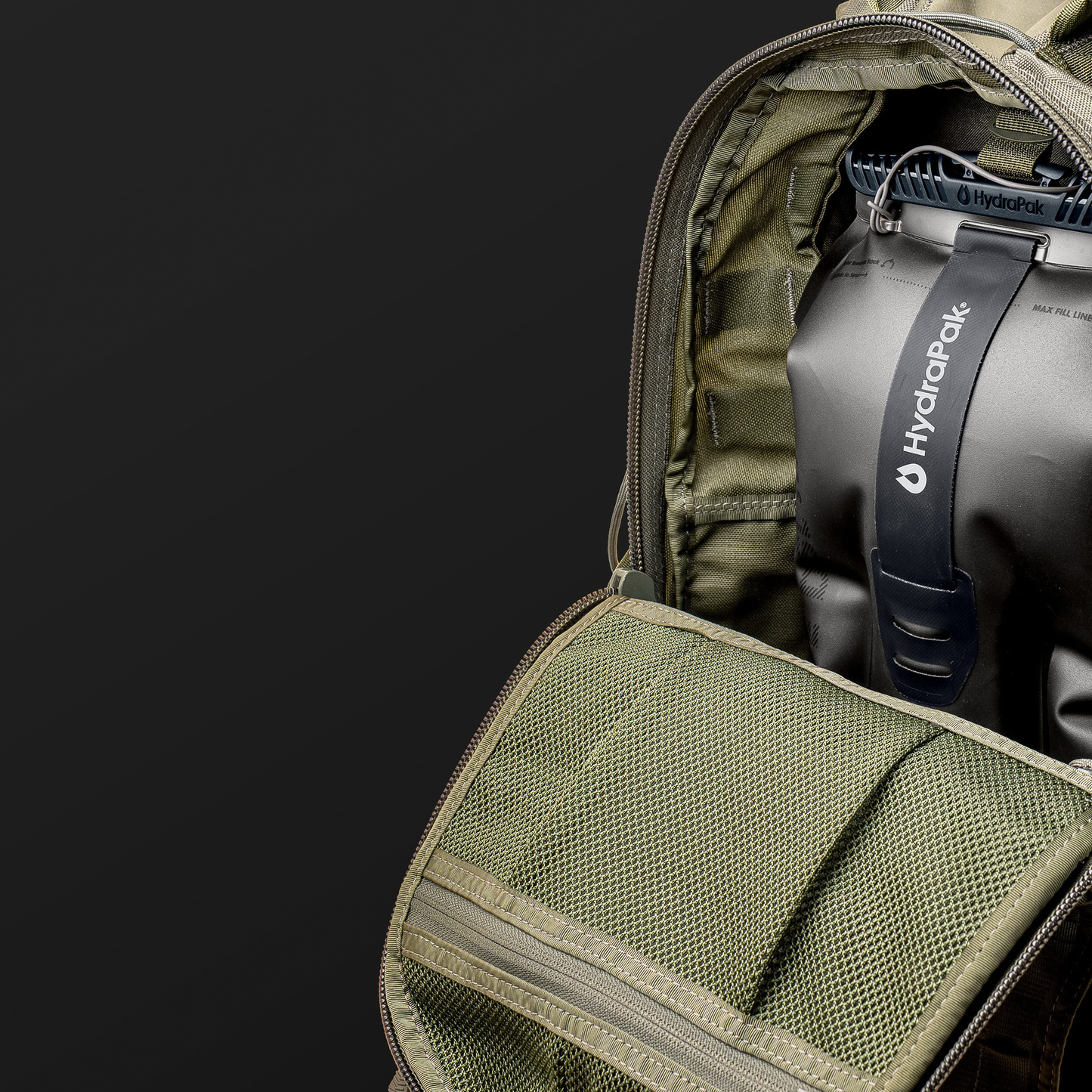 A close-up of a backpack featuring a hydration reservoir, highlighting its rugged construction and easy-access design.