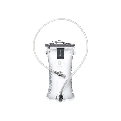 Clear Hydrapak Velocity water bladder with a hose, designed for easy filling and leakproof hydration during outdoor activities.
