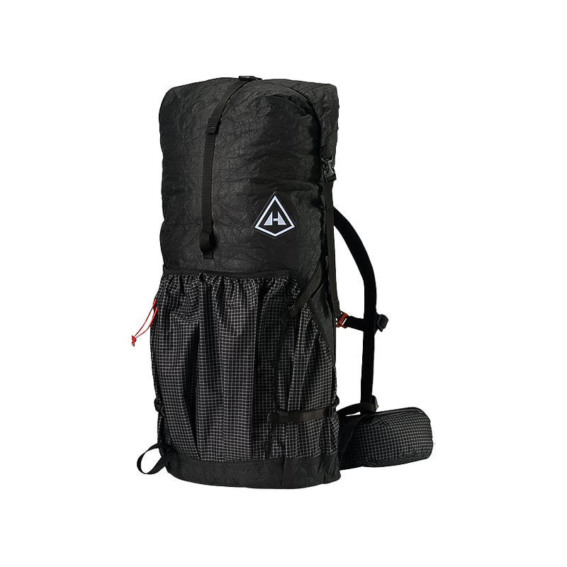 A black Hyperlite Mountain Gear Southwest Pack 55L hiking backpack with a roll-top closure, mesh front pocket, side straps, padded hip belt, and a triangular logo on the front.