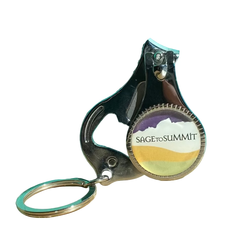 Keychain nail clippers with a sage to summit logo, also with a nail file and bottle opener 
