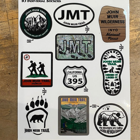 Sheet of 10 individual John Muir Trail stickers on a wooden backrgound