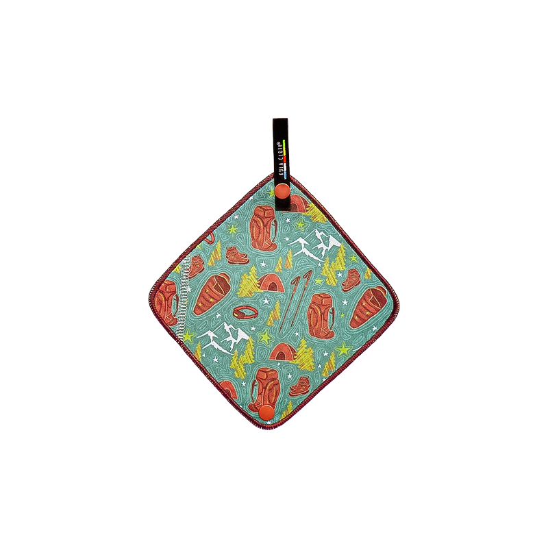 Green and brown patterned pee cloth with a black handle, ideal for outdoor cooking.