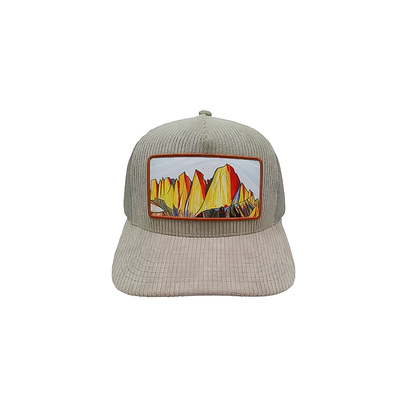 Khaki corduroy trucker hat showcasing a mountain scene, designed for comfort with a mesh back.