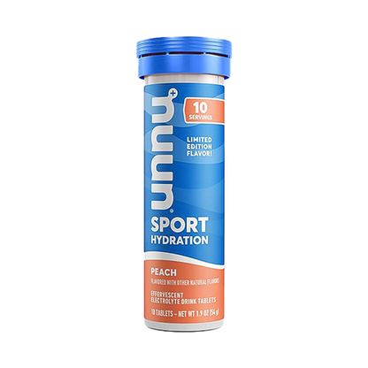 A bottle of peach Nuun Sport hydration tablets on a white background, featuring subtle flavors and essential electrolytes.