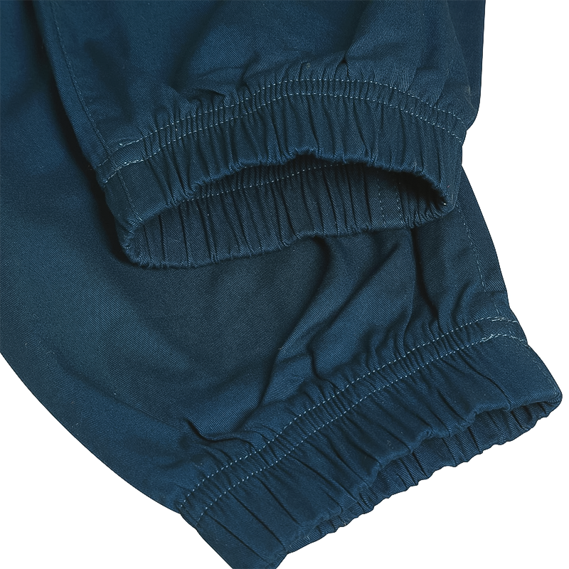 Close-up of blue Ocun Sansa Pants leg opening, designed for women's comfort and versatility in climbing and outdoor adventures.