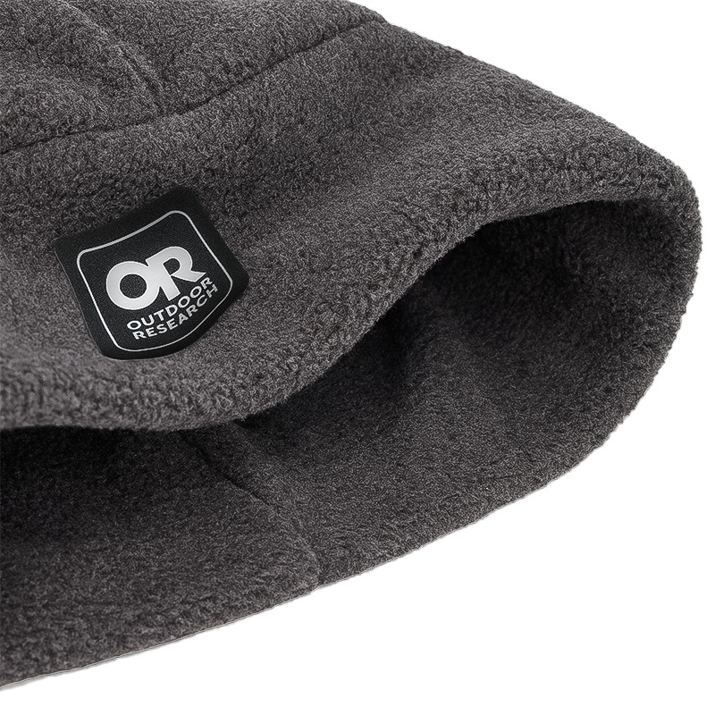 Outdoor Research logo on a gray beanie, ideal for winter sports, offering lightweight warmth and UPF 50+ sun protection.