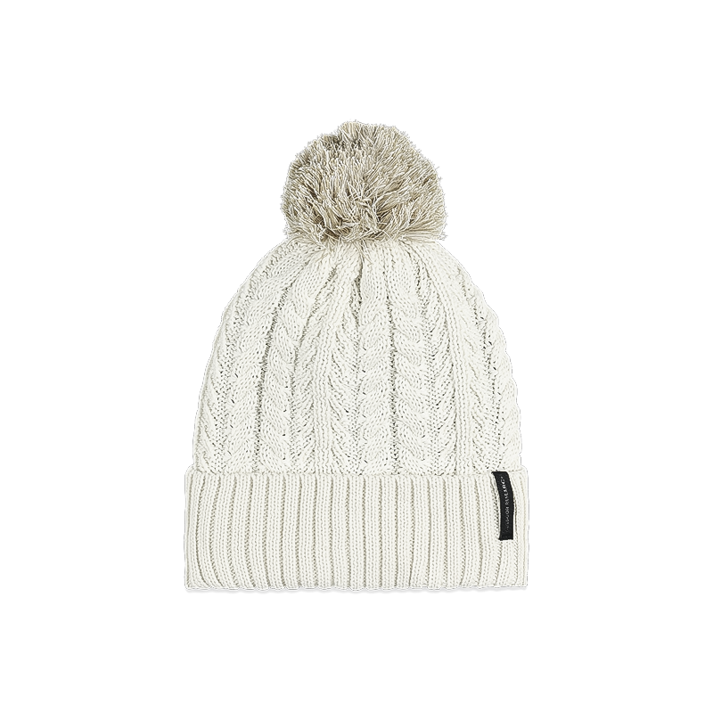 Cozy white cable knit beanie with a vibrant pom pom, ideal for winter outings.