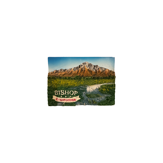 Colorful acrylic magnet featuring Eastern Sierra mountains, river, and valley with "Bishop, California" text.