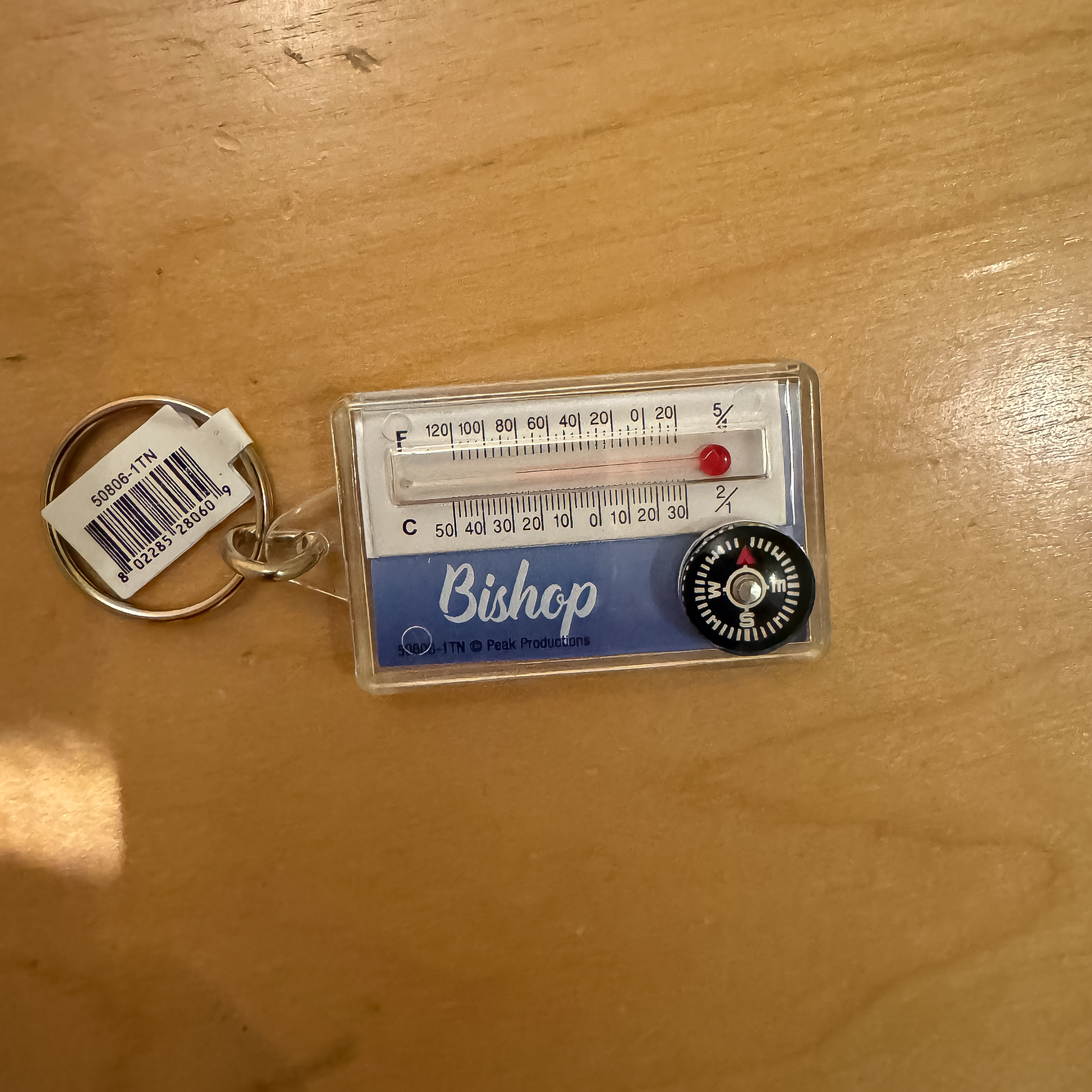 Functional keychain with a thermometer, perfect for travel and outdoor activities.