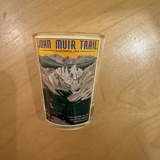 John Muir Trail shot glass with retro design of Sierra Nevada peaks, honoring the iconic hiking route from Mt. Whitney to Yosemite.