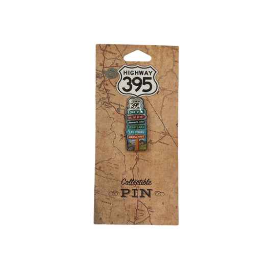 Pin on a card with 'Highway 395' design on a plain background