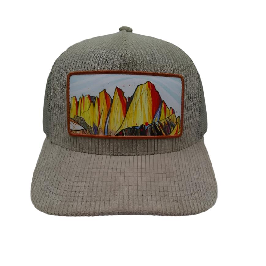 Mt. Whitney Khaki Corduroy Trucker HatA khaki trucker hat made of corduroy fabric with a mesh back, featuring a curved brim and a plastic snapback closure