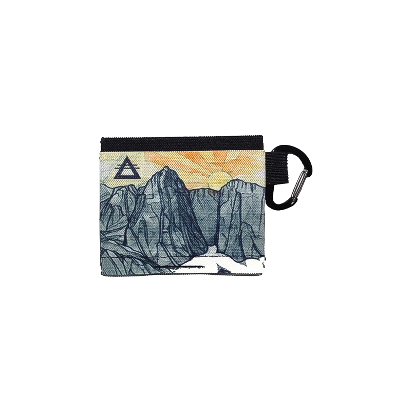 A compact wallet with a mountain landscape, ideal for adventurers needing a lightweight, secure storage option.