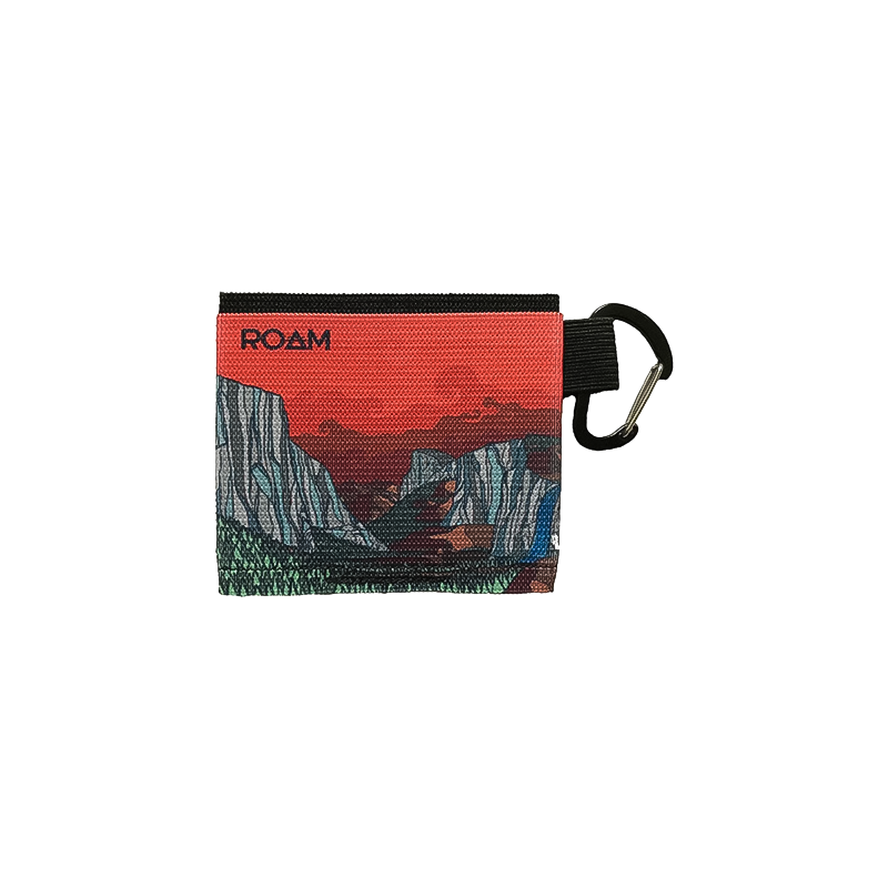 Red wallet with a mountain design, perfect for adventurers, featuring three compartments.